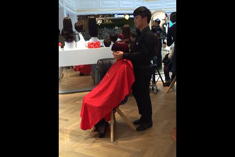 A young woman having a wig cut - this is a new trend in China